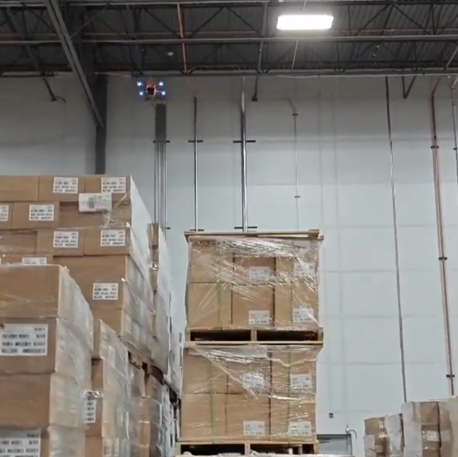 Corvus One drone scanning bulk pallet storage from overhead